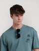 CAMISETA OVERSIZE LOGO ESPALDA PALMERAS
